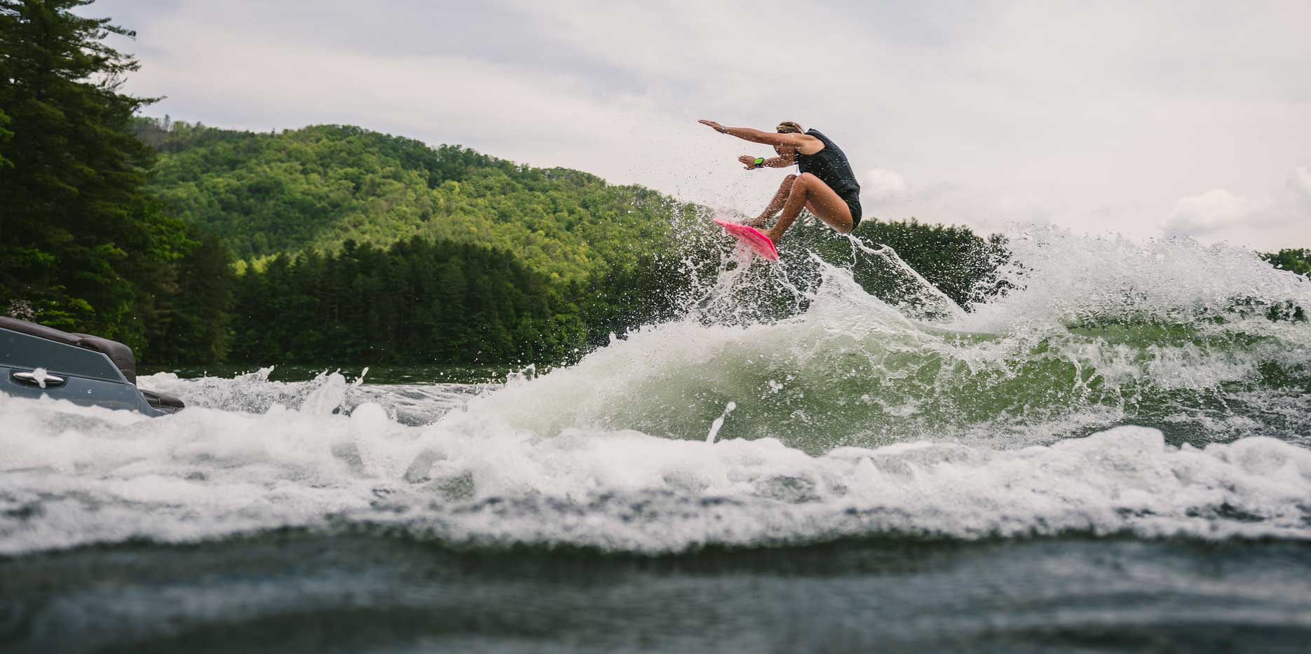 Wakesurfing behind the Malibu Boats 22 MXZ