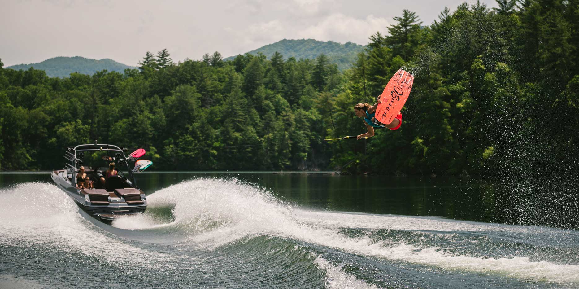 Tarah Mikacich wakeboarding behind the Malibu Boats 22 MXZ