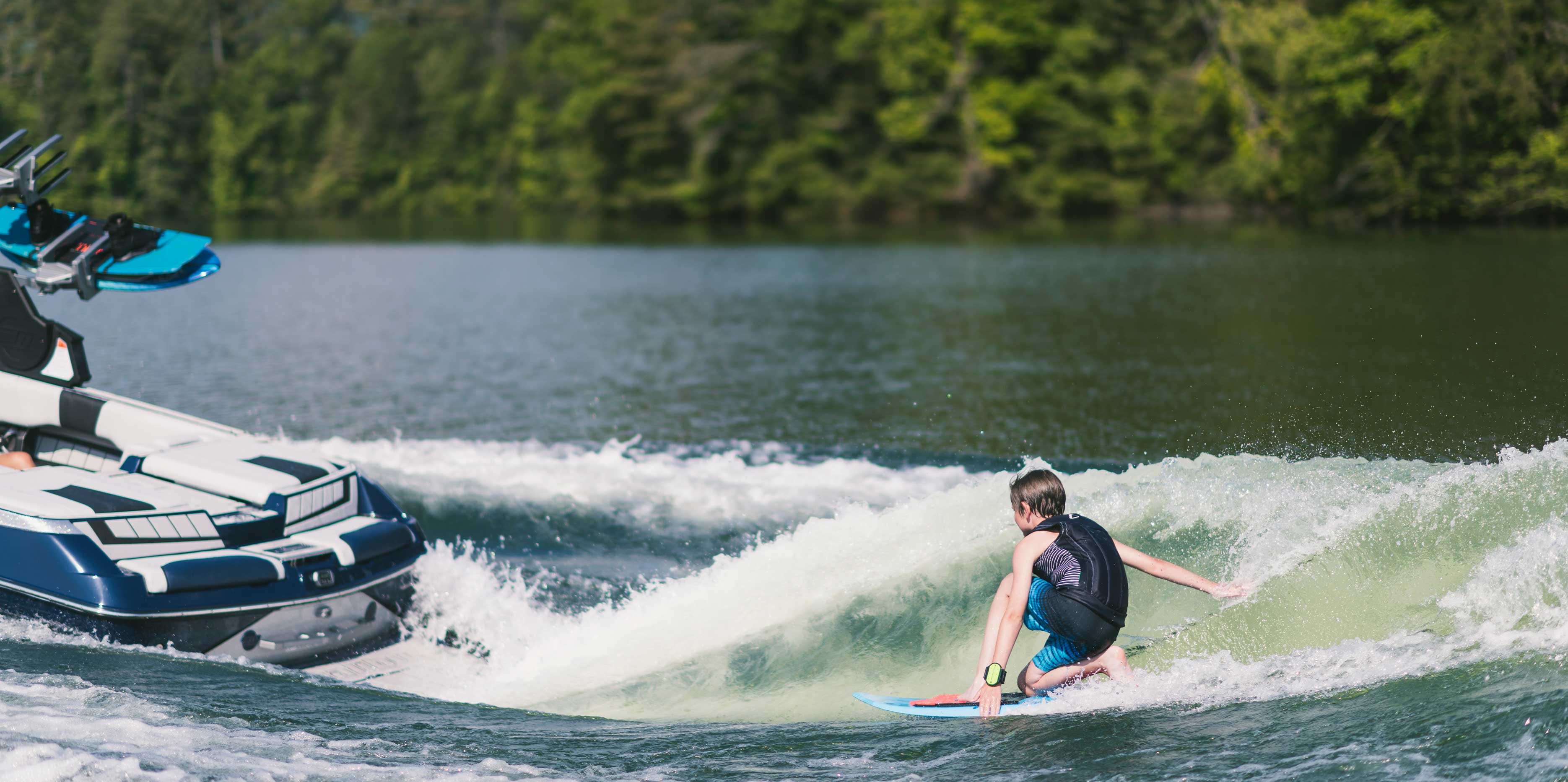 Wakesurfing behind the 24 MXZ