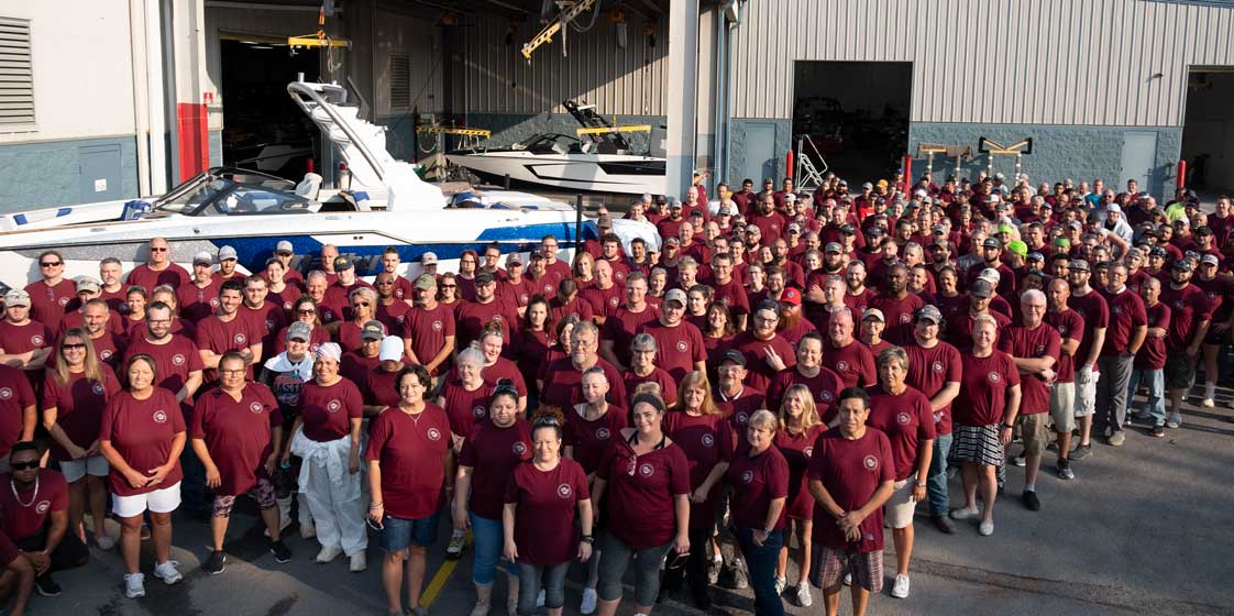 The Malibu team assembled outside of the main plant.