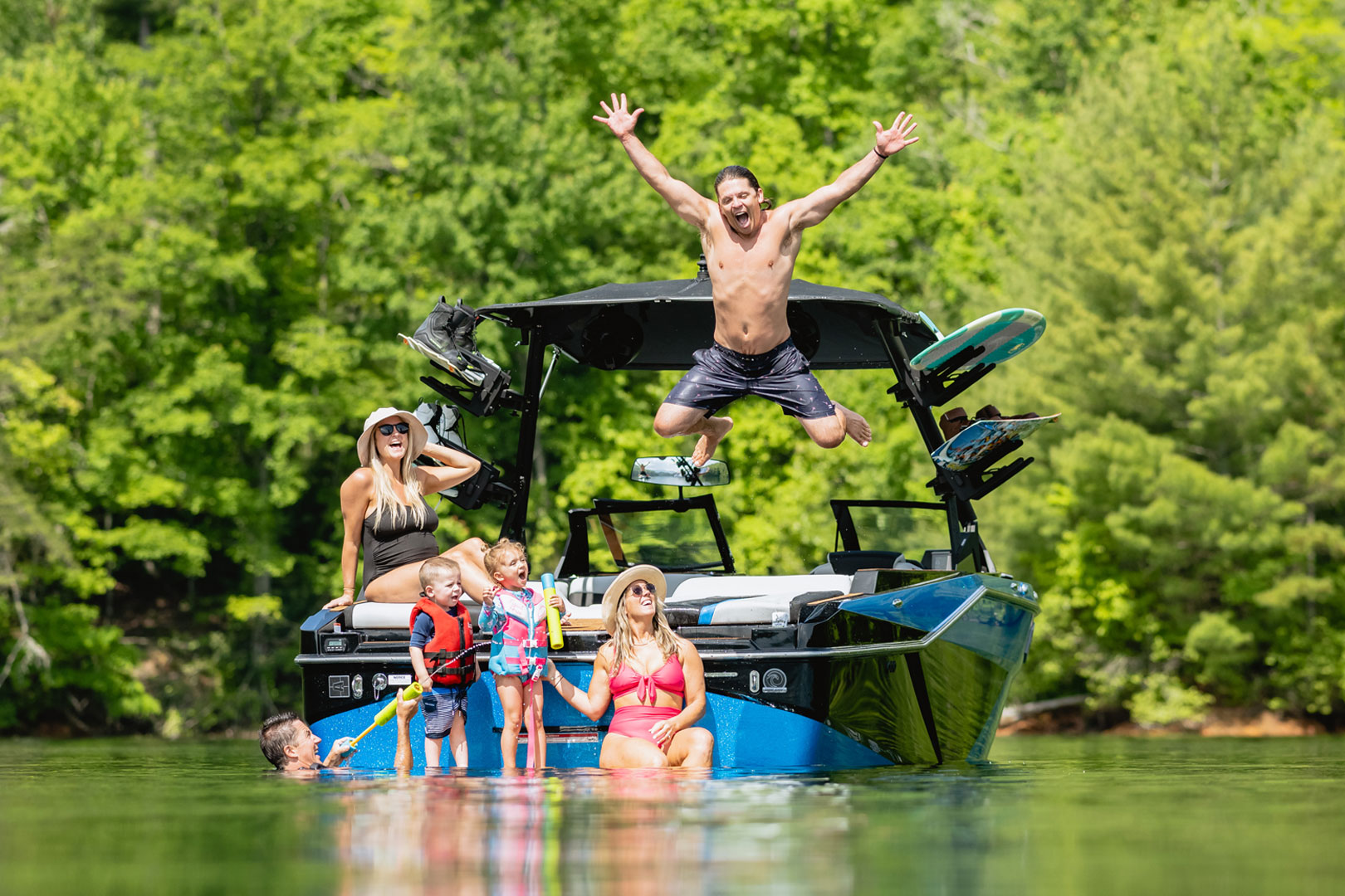 Family Jumping Off Axis T250 Into Water