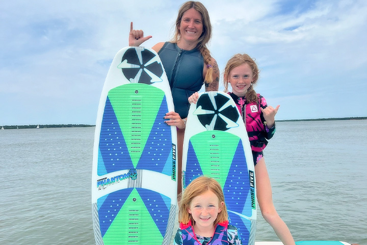 Axis Neal Family Wakesurfing Posing on Swim Platform