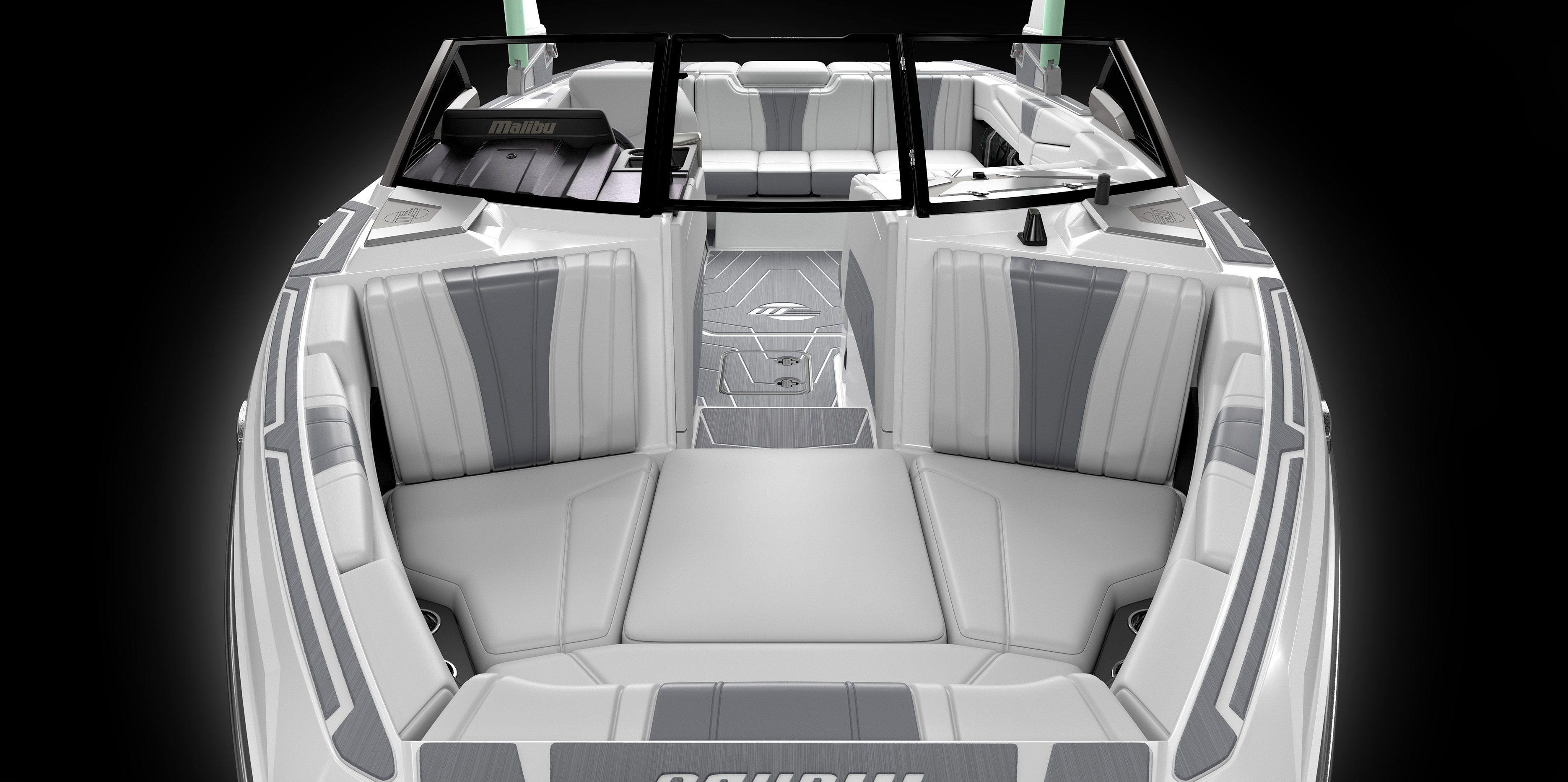 Wide interior view of the Malibu Wakesetter 22 LSV showcasing multi-view bench seating, spacious lounge, and soft grip flooring.